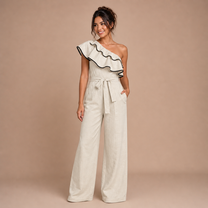 Paloma – skulderløs jumpsuit med struktureret flæse og justerbar talje